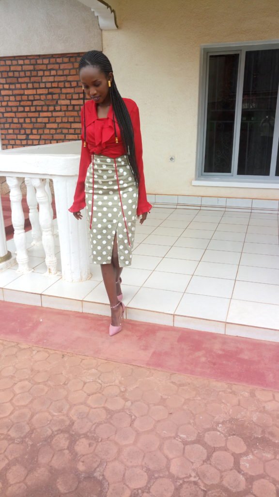 green skirt with white polka dots with red blouse